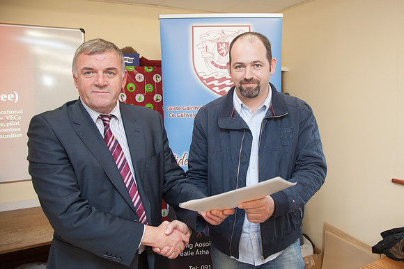 BIM_-0136 12/12/12: Údarás na Gaeltachta CEO Steve Ó Cúláin presenting a certificate to John Joe Lydon, Indreabhán. Pic: Seán Ó Mainnín